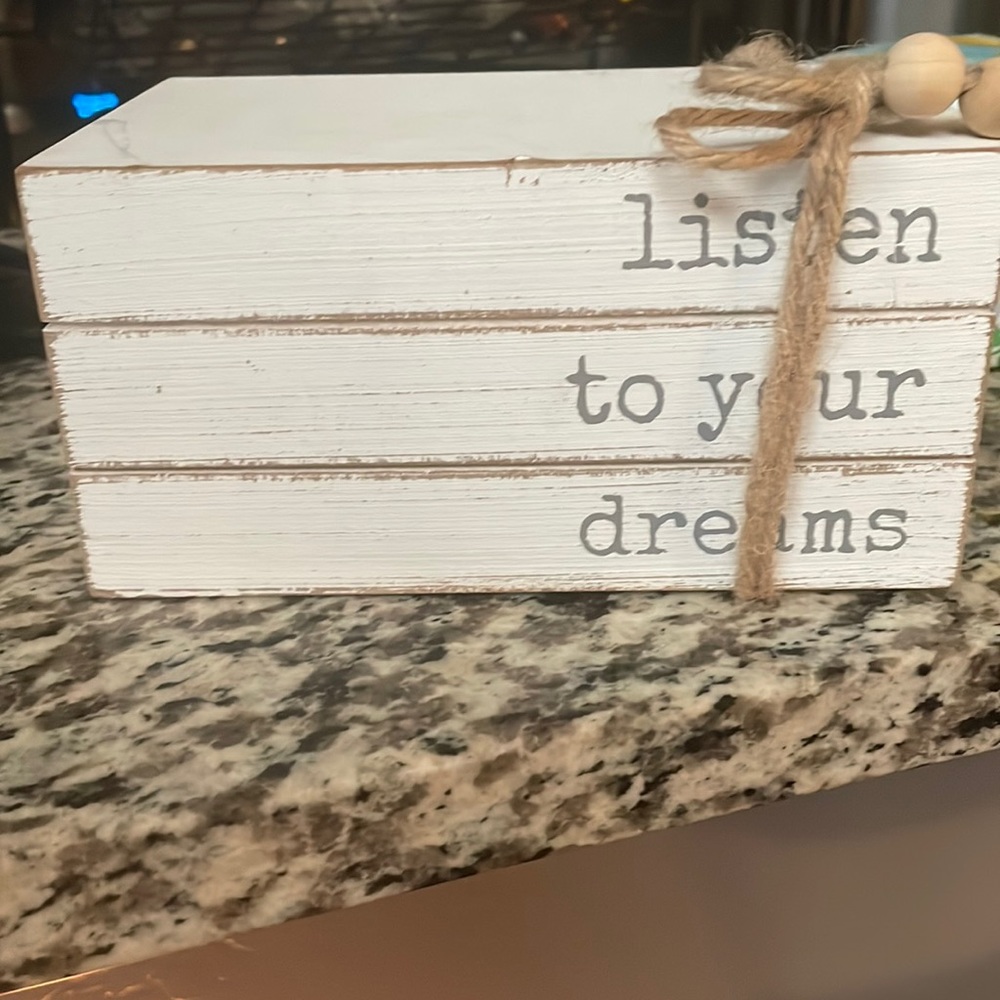 Three book stack listen to your dreams